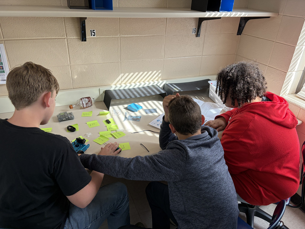 junior high students building robots