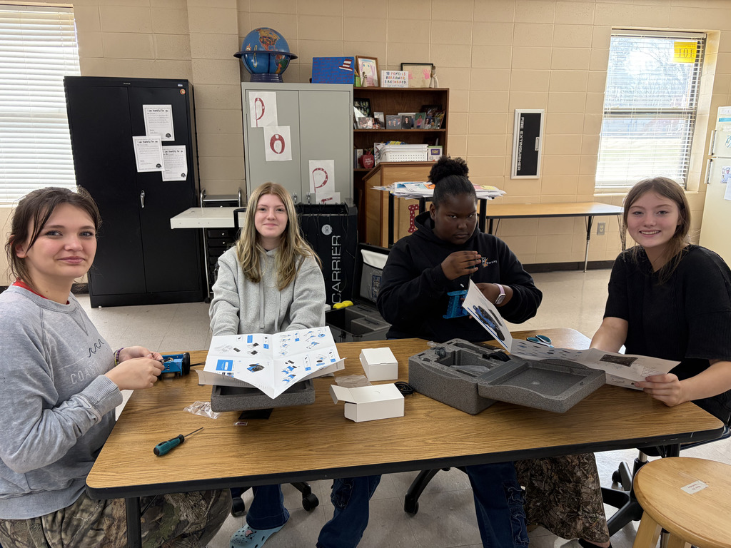 junior high students building robots