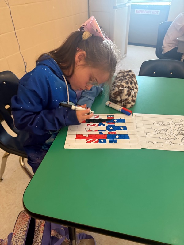 4th grade students working on a craft