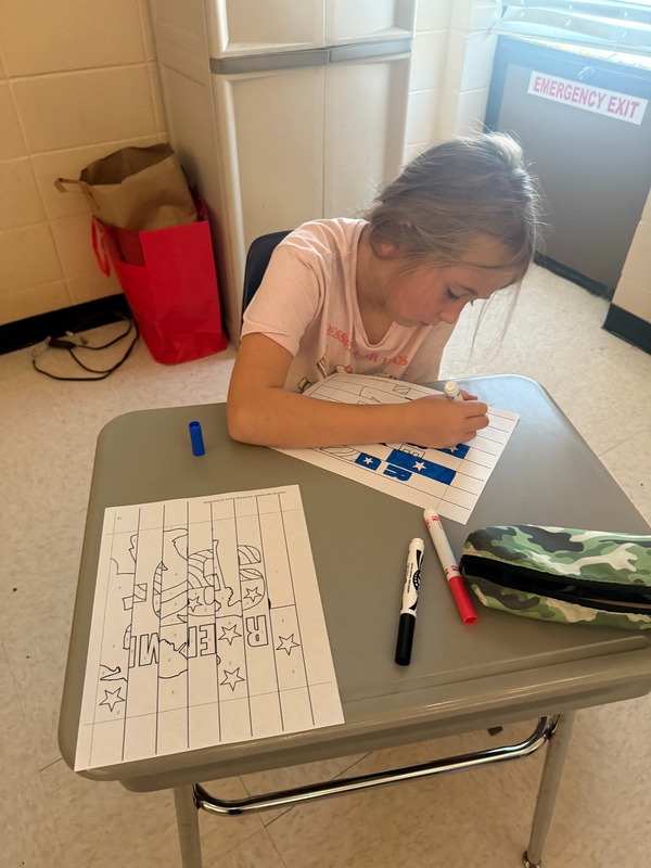 4th grade students working on a craft