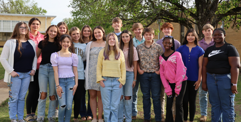 group of junior high students standing outside
