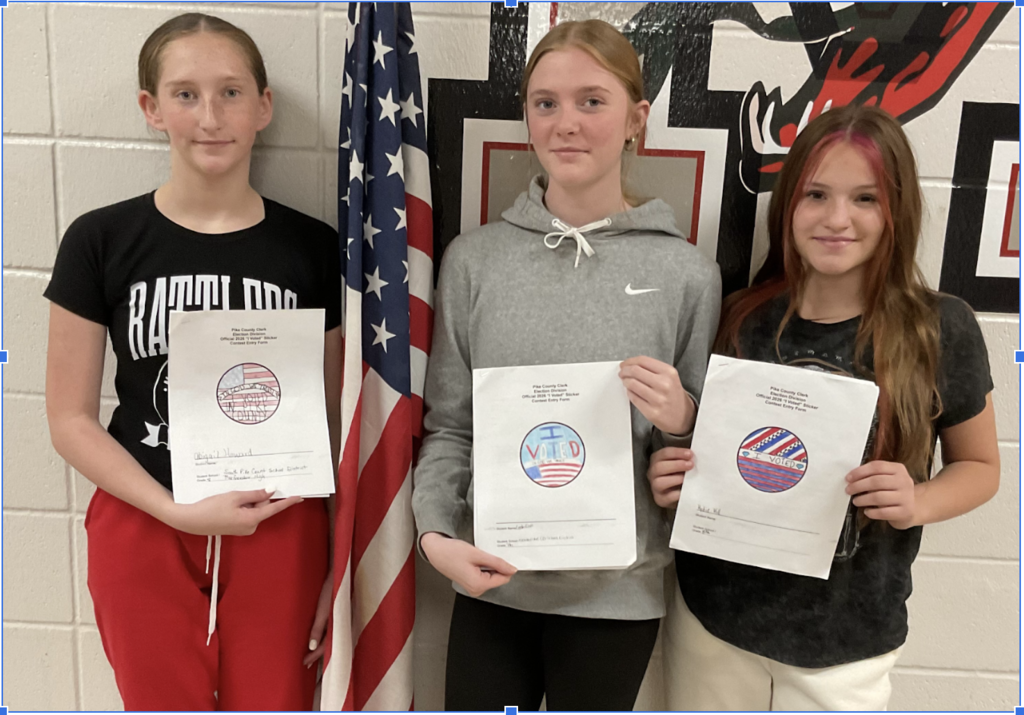 Picture of girls holding "I voted" sticker art.