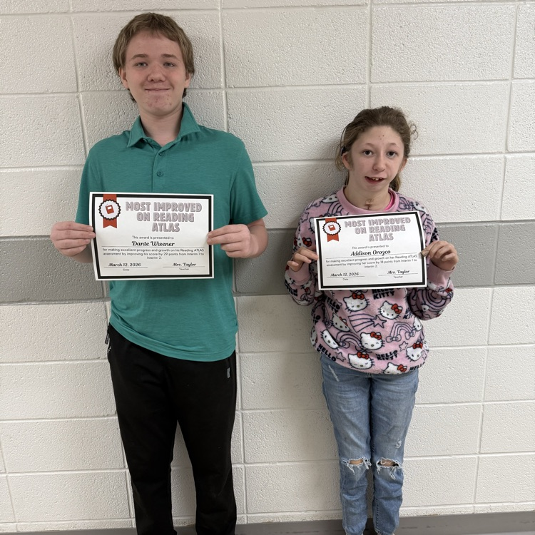 Students  holding their certificates.