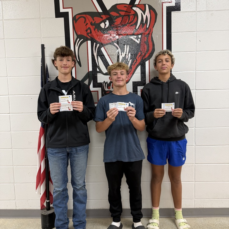 kids holding homework passes