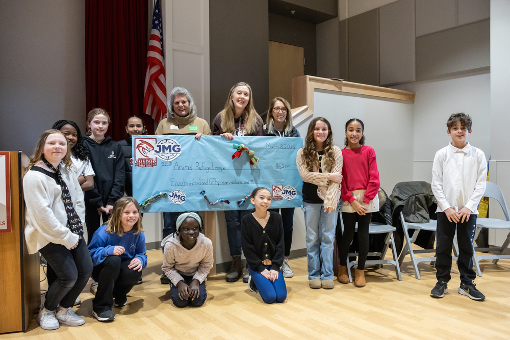 SPMS students present a donation check to Animal Refuge League of Greater Portland