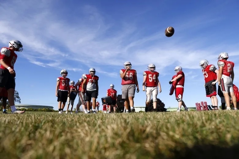 Linemen run drills during South Portland football practice on Tuesday. (Staff photo by Derek Davis)