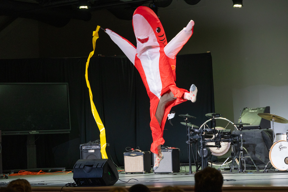South Portland Middle School 2nd Annual Talent Show and Fundraiser. (Picture: Staff member dressed in shark costume jumping on stage during Talent Show.)