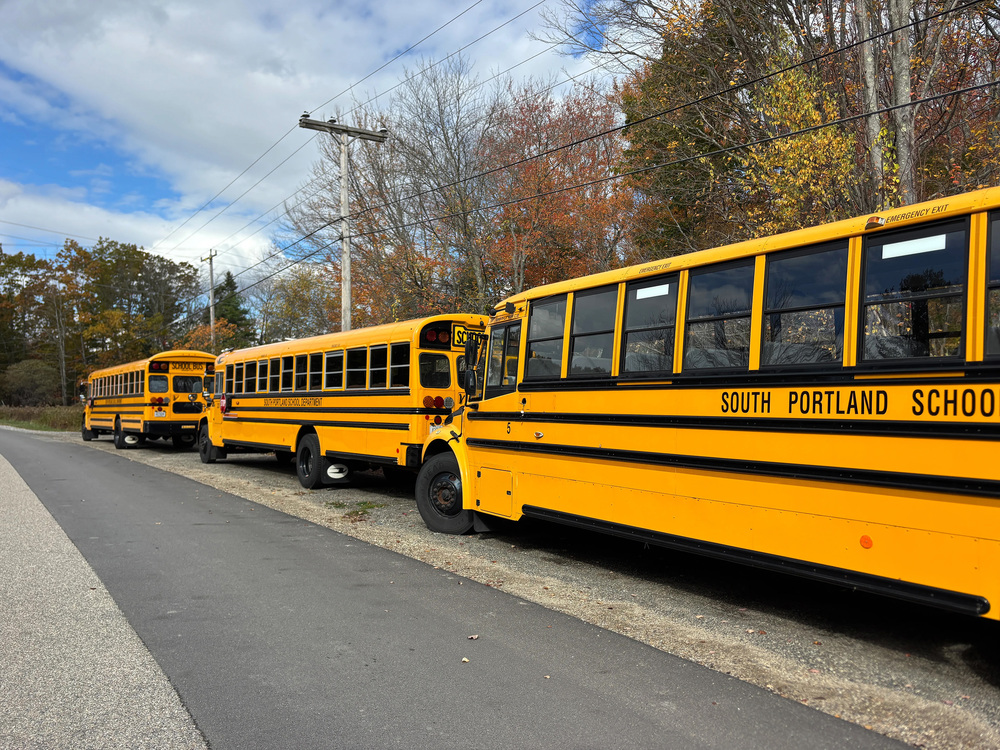 School buses were parked outside the South Portland School Transportation Department office as bus drivers shared a donated barbecue lunch. (Dana Richie/Staff Writer)