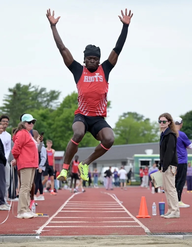 South Portland Bossay Ditanduka competes in the long jump at the Class A championship meet on Saturday in Bangor. Ditanduka won in 22-4 1/4. (Rich Abrahamson/Staff Photographer)