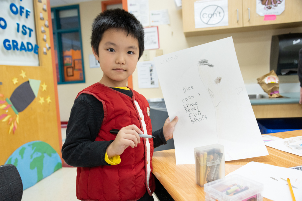 First grader at Kaler Elementary creating a self portrait