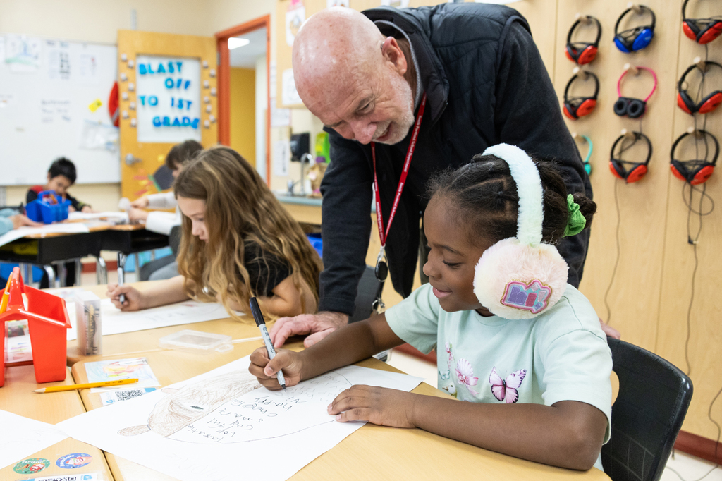Superintendent Entwistle with first graders at Kaler Elementary creating self portraits