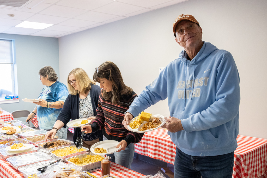 Transportation staff enjoying food from Moe's Original BBQ