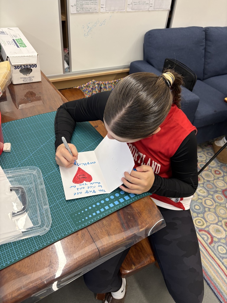 SPMS student creating thank you card for school board members.