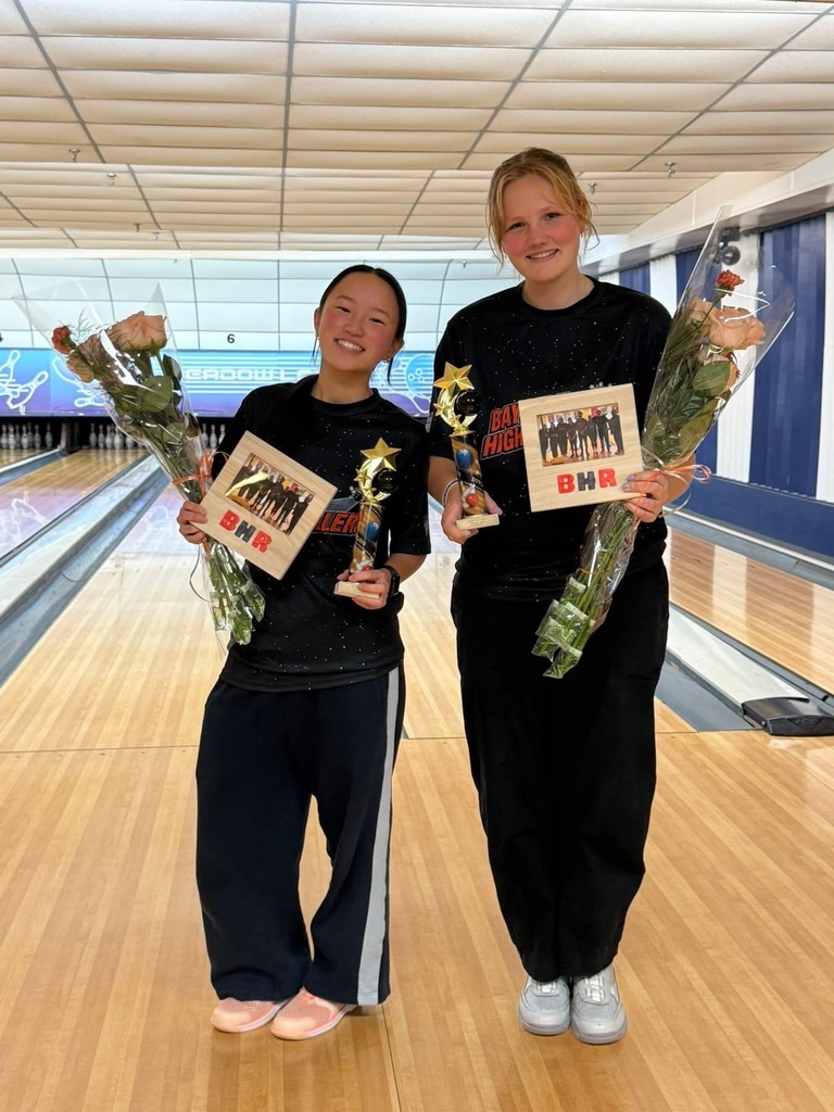 Amelia and Lily celebrating the Bayside High Rollers championship title