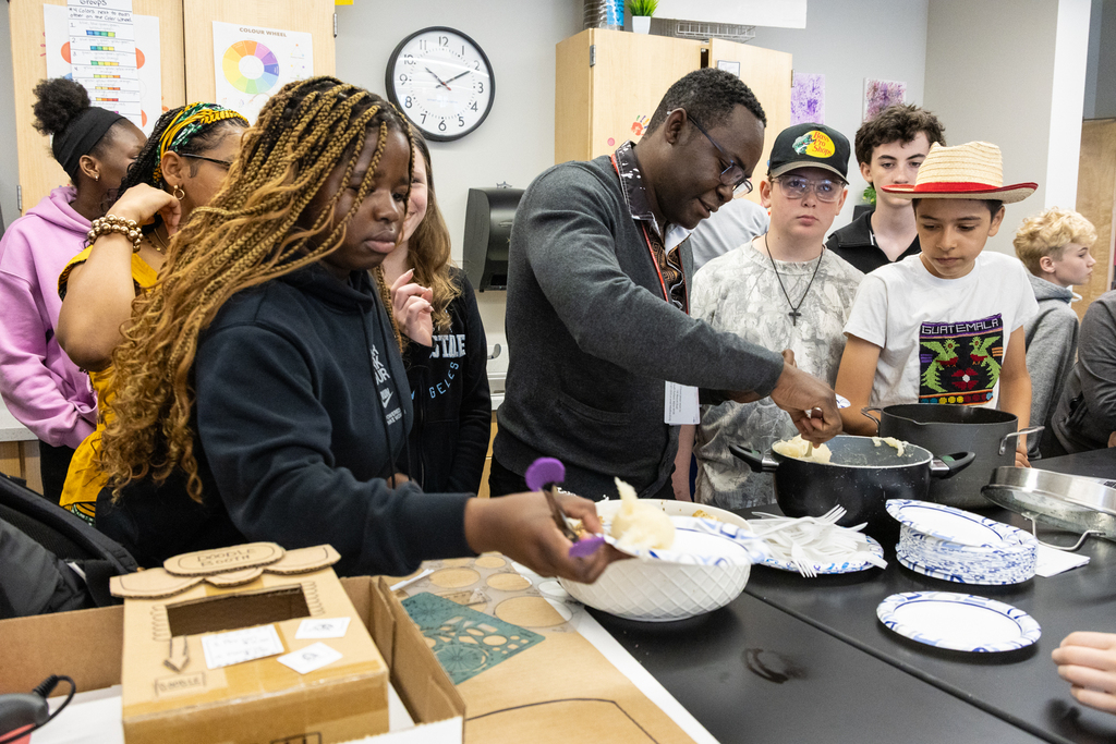 Students participating in a fufu making workshop.