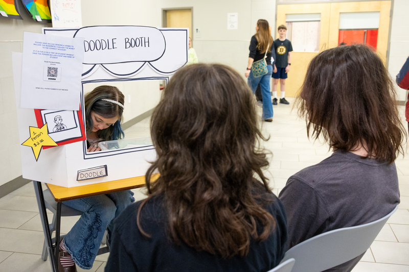 SPMS Talent Show & Fundraiser - Student drawing at Doodle Booth