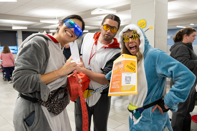 SPMS Talent Show & Fundraiser - Staff members dressed as sharks on roller blades selling raffle tickets