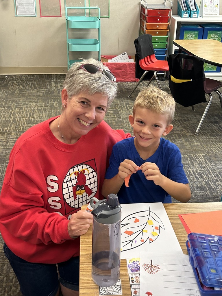 A teacher and a student working in an assignment