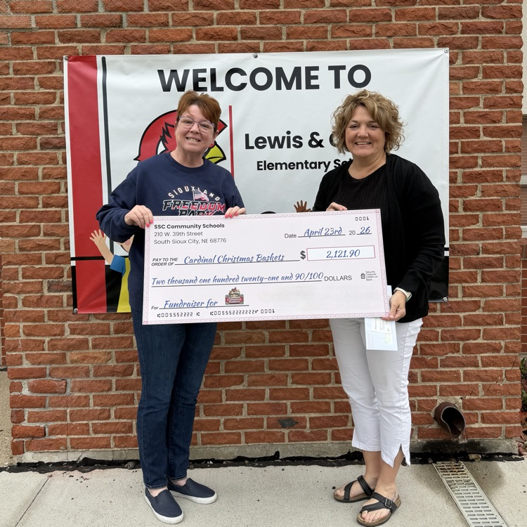 cardinal Christmas baskets donation check presentation 