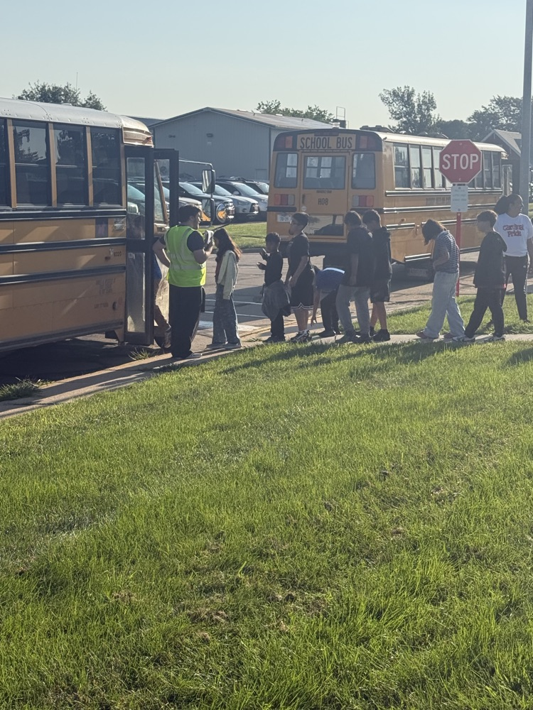 students practicing bus safety evacuation procedures 