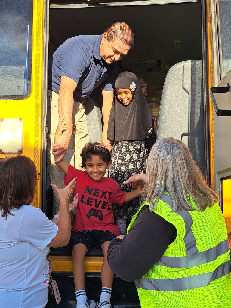 students on a school bus practicing bus safety skills