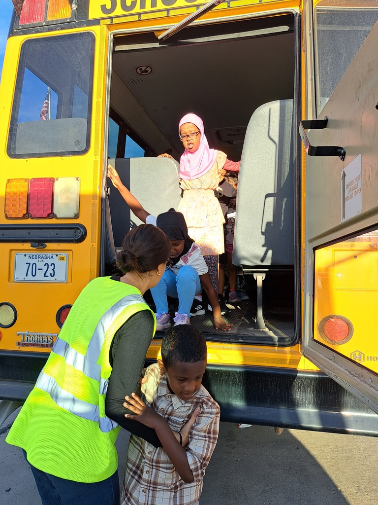 students on a school bus practicing bus safety skills
