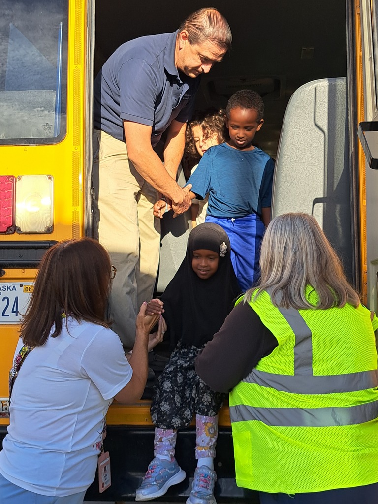 students on a school bus practicing bus safety skills