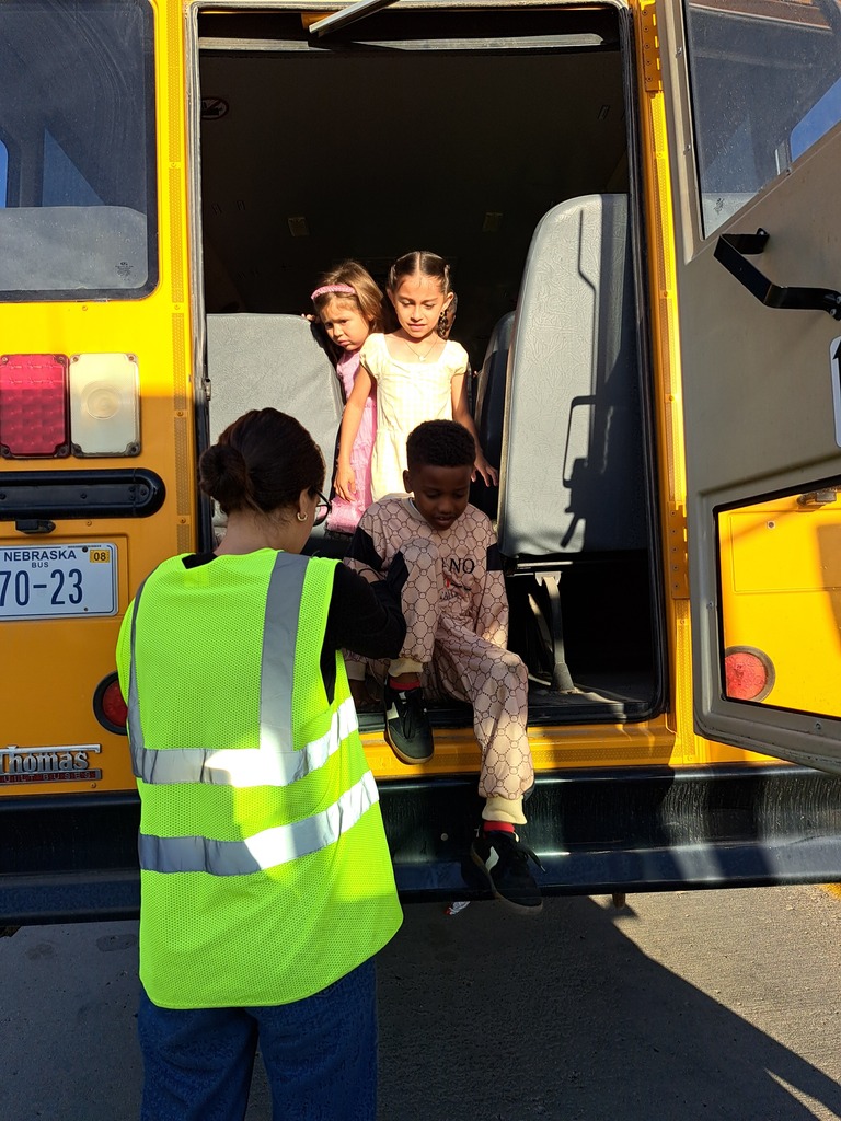 students on a school bus practicing bus safety skills