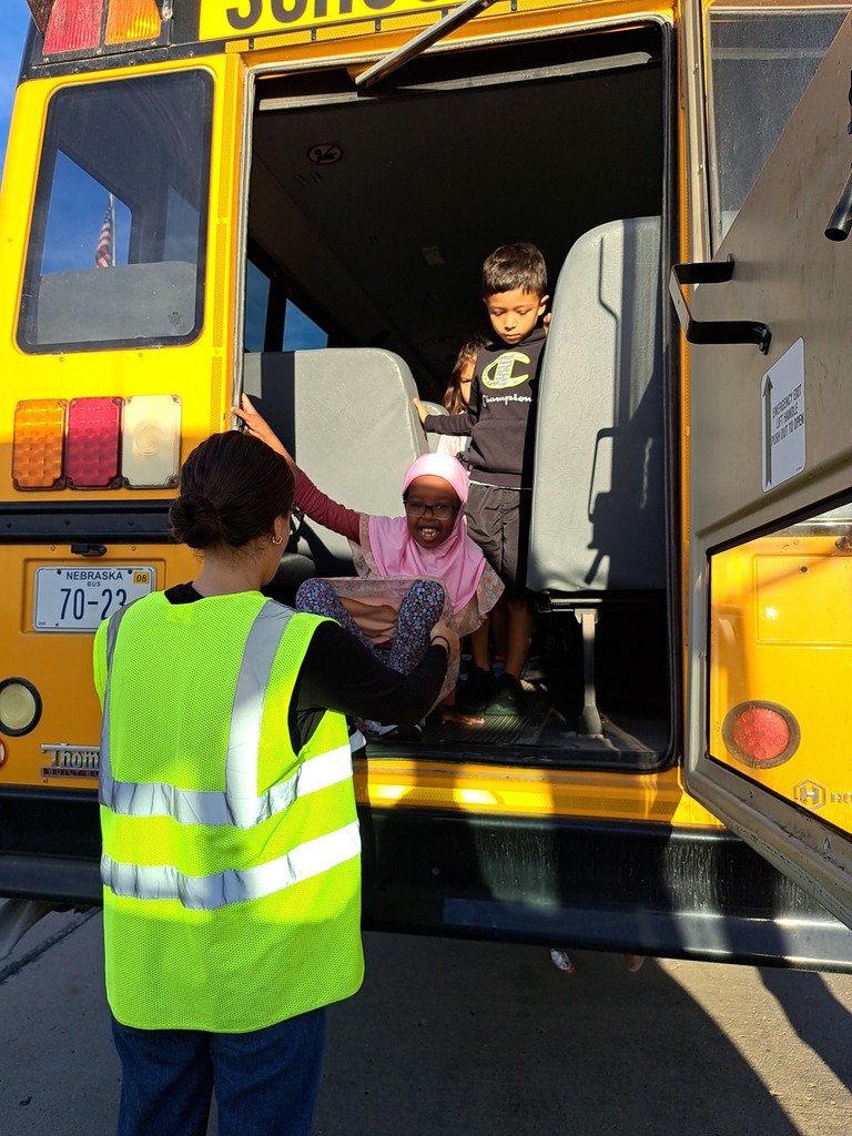 students on a school bus practicing bus safety skills