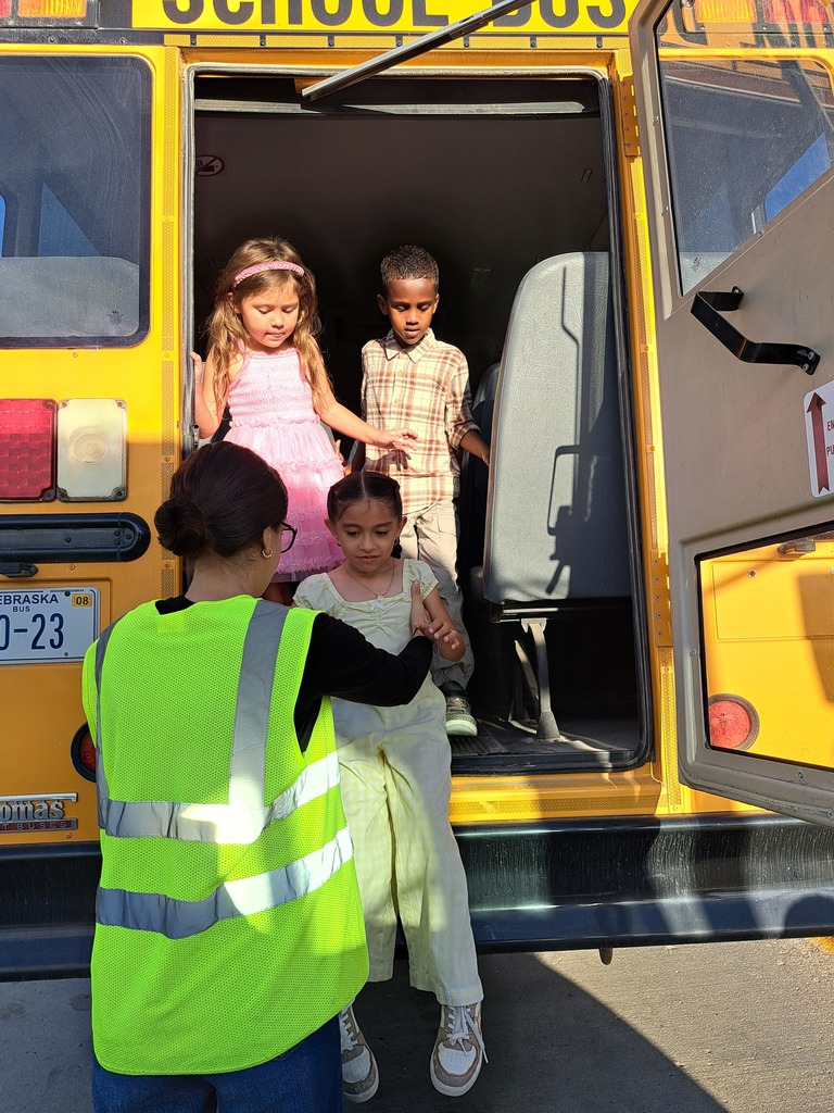 students on a school bus practicing bus safety skills
