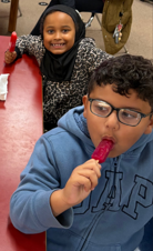 students enjoying popsicles