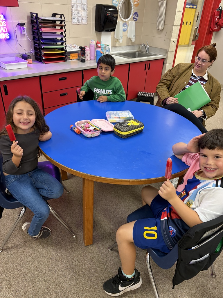 students enjoying popsicles