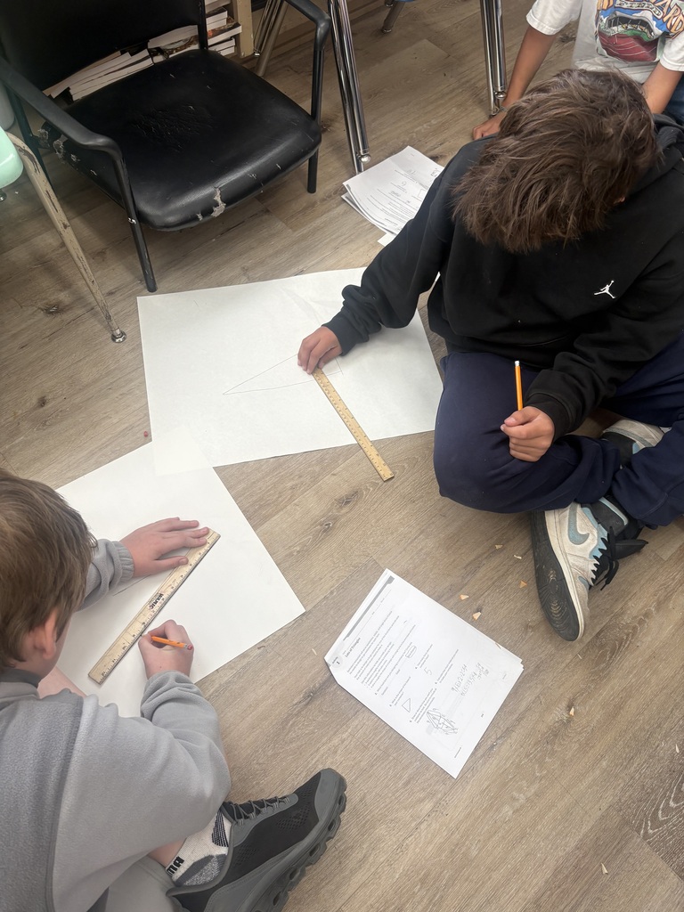 Students calculating surface area of their containers
