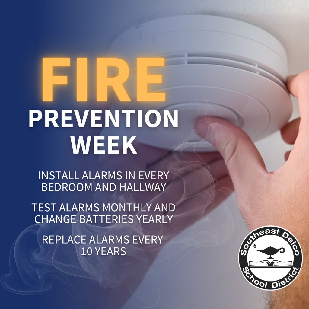 Fire Prevention Week graphic with a background photo of a person testing a smoke alarm on the ceiling. Text reads: “Install alarms in every bedroom and hallway. Test alarms monthly and change batteries yearly. Replace alarms every 10 years.” The Southeast Delco School District logo appears in the bottom right corner.
