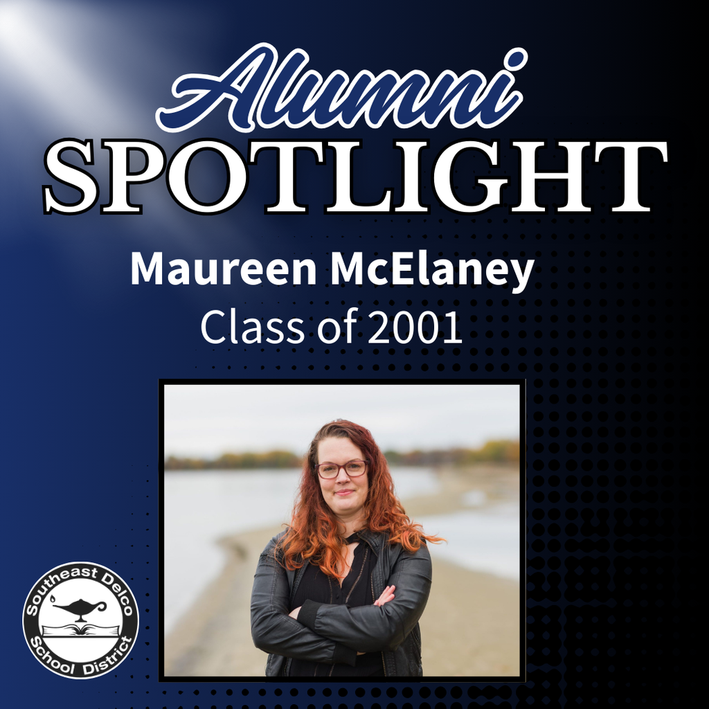 Graphic titled "Alumni Spotlight" featuring Maureen McElaney, Class of 2001. The image shows Maureen standing with arms crossed, smiling in front of a lake or river with a blurred shoreline in the background. The Southeast Delco School District logo appears in the lower left corner.
