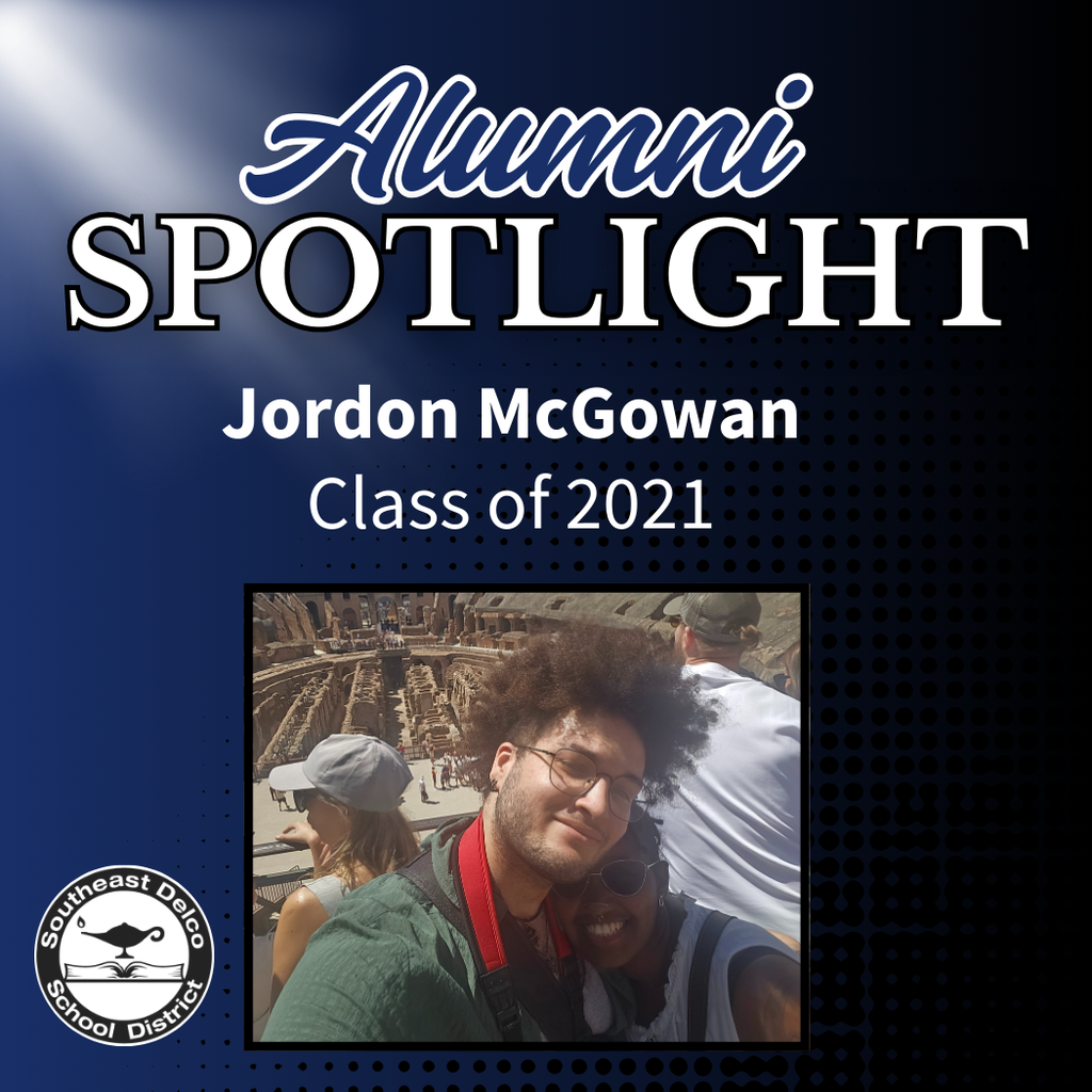 Alumni Spotlight for Jordon McGowan, Class of 2021, with a quote about community and a photo of him smiling at the Colosseum in Rome. Southeast Delco School District logo appears in the corner.
