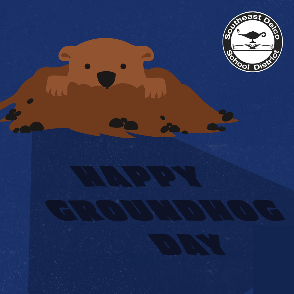 Brown groundhog silhouette casting a shadow with the words 'Happy Groundhog Day' on a deep blue background, featuring the district logo.