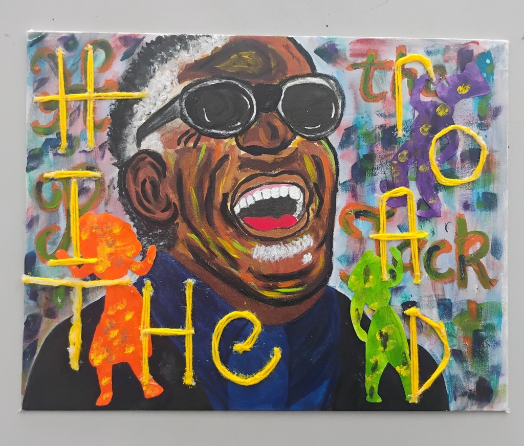 Abstract artwork featuring vibrant yellow text intertwined with orange and green silhouettes against a multicolored background.