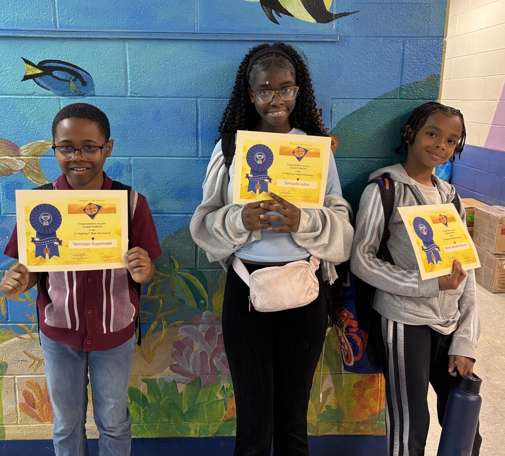 Three students proudly display Math 24 Challenge achievement certificates in front of a colorful school mural.