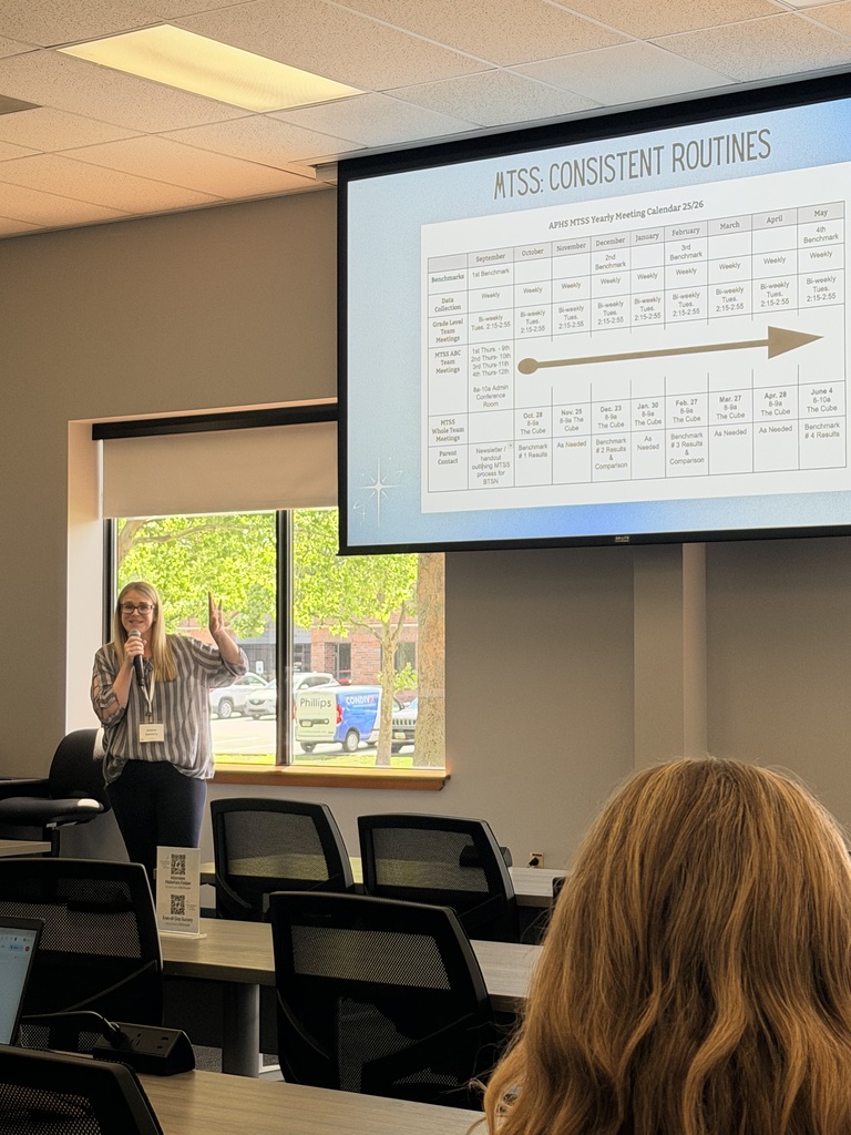 Presenter discusses consistent MTSS routines while showing a yearly meeting calendar to educators during a professional learning session.