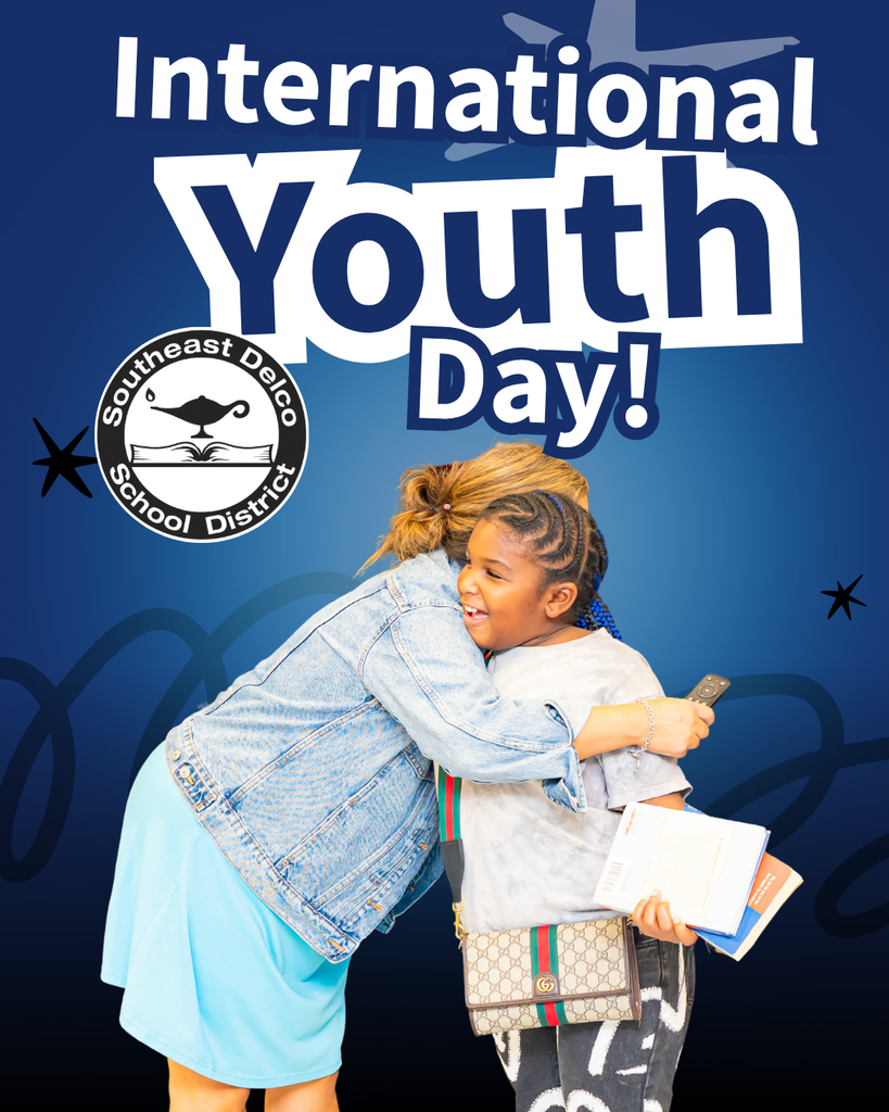 A young girl holding books and a phone warmly hugs an adult woman in a denim jacket against a blue background celebrating International Youth Day.
