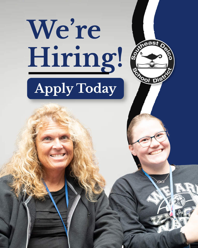 Two smiling women wearing lanyards with Southeast Delco School District logo and text saying We're Hiring! Apply Today.