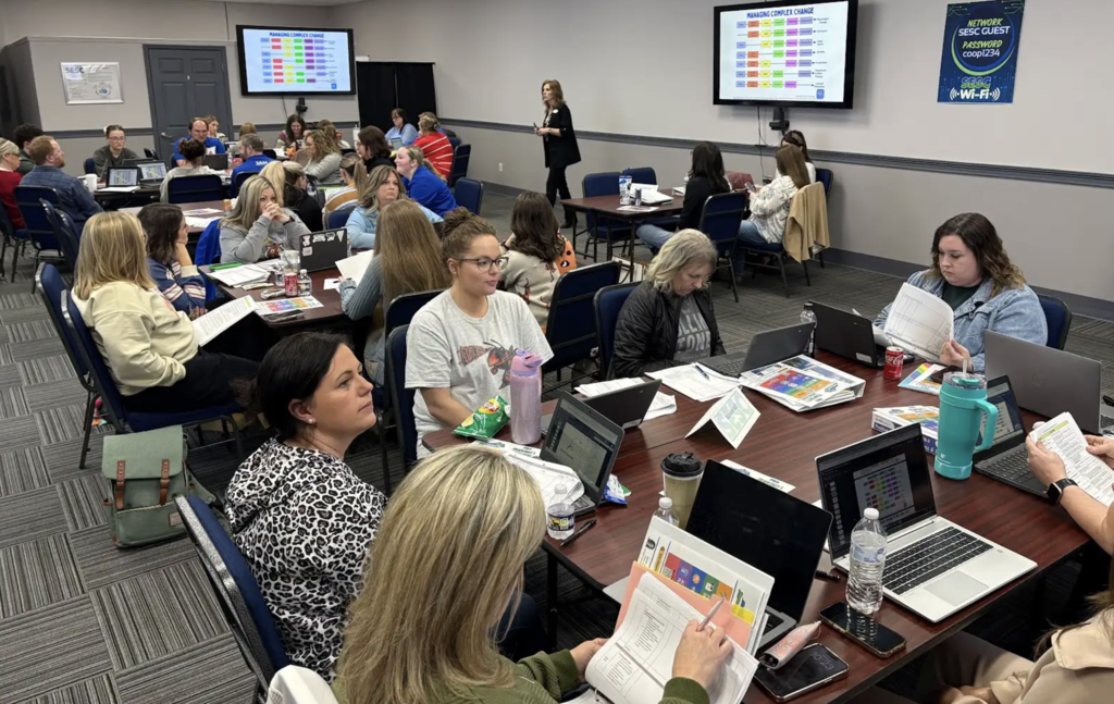 Images of teachers participating in a training session on PBIS