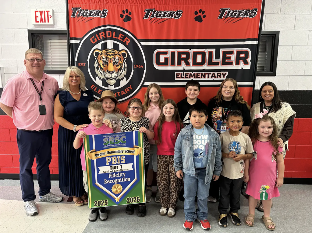 students holding a banner