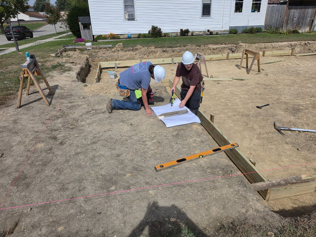 Building Trades II Class working on footers for the new project house.