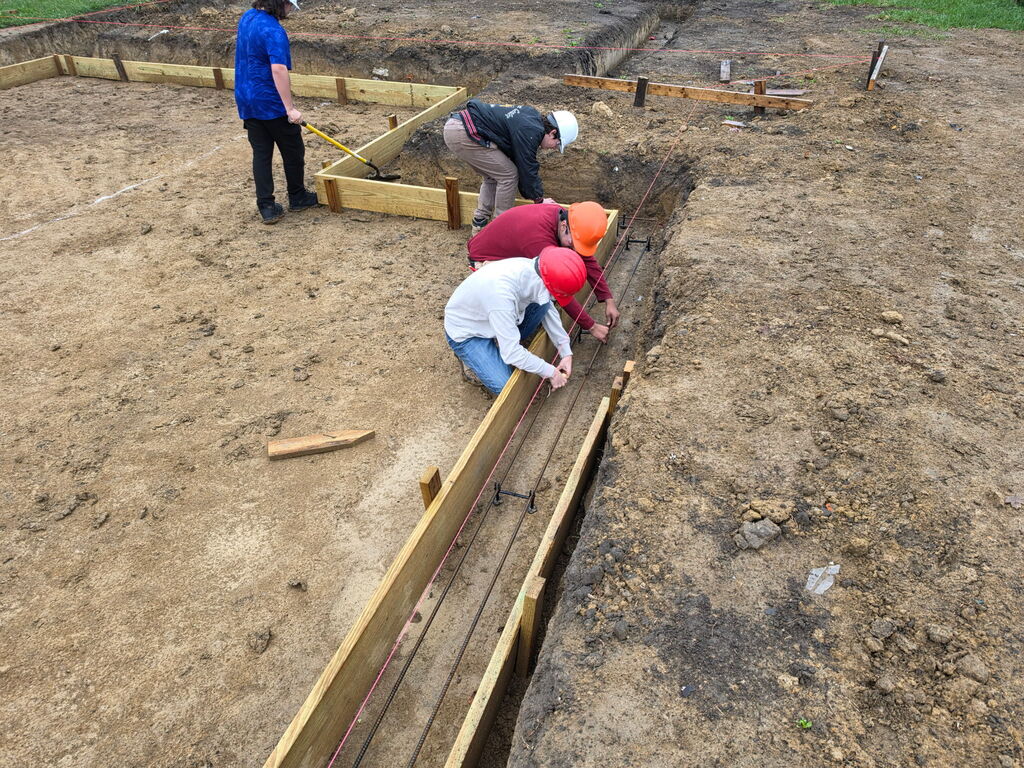 Building Trades II Class working on footers for the new project house.