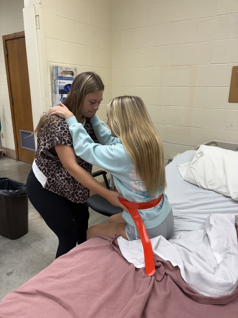 Health Science II students are practicing essential patient-care skills by learning how to safely transfer patients from gurneys and wheelchairs to beds.