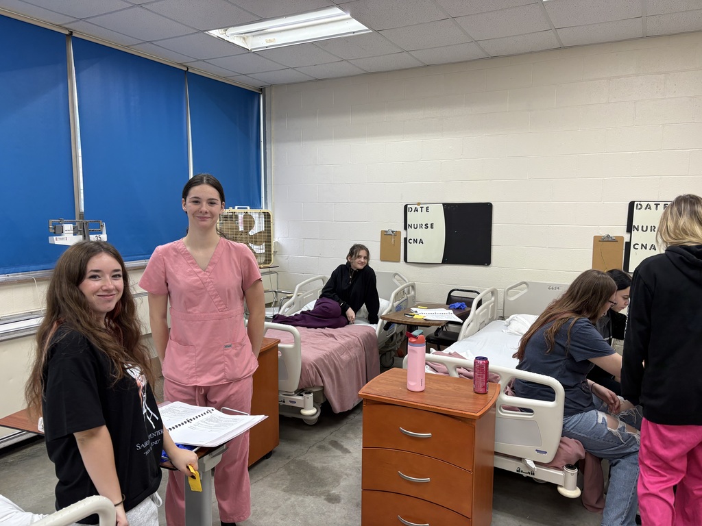 Health Science II students are practicing essential patient-care skills by learning how to safely transfer patients from gurneys and wheelchairs to beds.