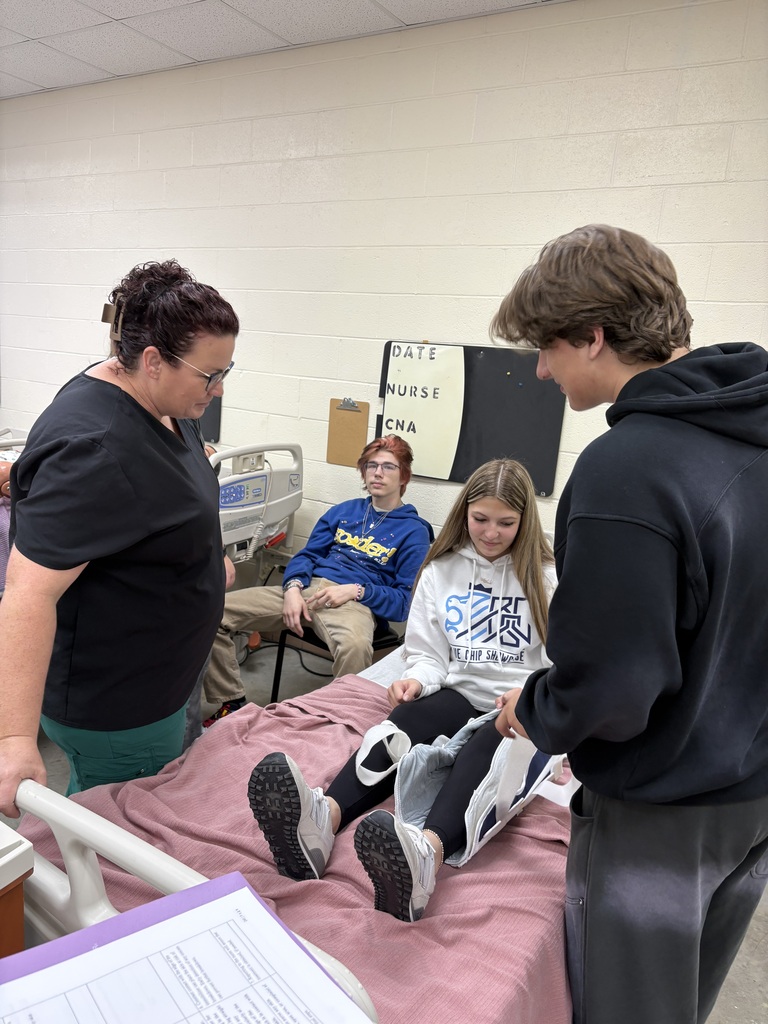 Health Science II students are practicing essential patient-care skills by learning how to safely transfer patients from gurneys and wheelchairs to beds.