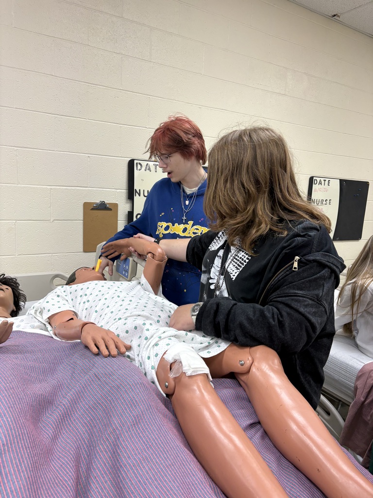 Health Science II students are practicing essential patient-care skills by learning how to safely transfer patients from gurneys and wheelchairs to beds.